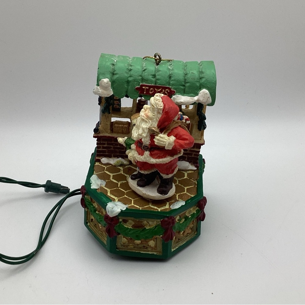 In Motion Ornament Made by Eluceo Christmas Spinning Santa Stocking And Boy Vtg